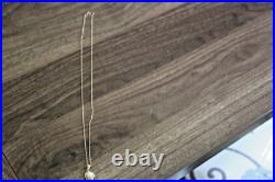 14 K Yellow Gold Necklace Set With A Pearl In Basket Chain 9.5'' Chain Is Fine