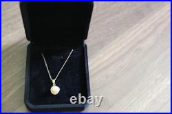 14 K Yellow Gold Necklace Set With A Pearl In Basket Chain 9.5'' Chain Is Fine