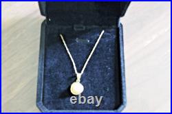 14 K Yellow Gold Necklace Set With A Pearl In Basket Chain 9.5'' Chain Is Fine