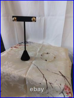 14 Karat Gold Dome Stud Earrings With A 14 Karat Gold Pearl Amethyst