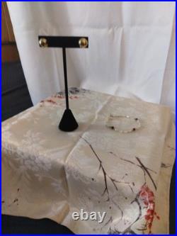 14 Karat Gold Dome Stud Earrings With A 14 Karat Gold Pearl Amethyst