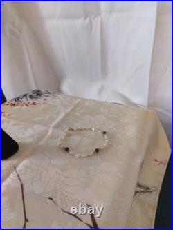 14 Karat Gold Dome Stud Earrings With A 14 Karat Gold Pearl Amethyst