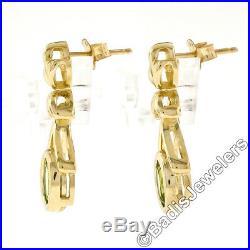 14K Yellow Gold 2.0ctw Oval Cut Bezel Set Peridot Open Drop Dangle Post Earrings