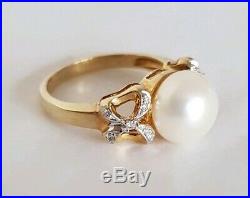14ct Yellow Gold Dress Ring. Claw set with two Eight cut Diamonds & Pearls