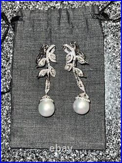 18 k White gold necklace and earrings with pearl and Diamonds