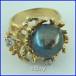 18 kt yellow gold ring with 12mm black pearl & 2 diamonds modern brutalist setting