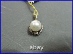 5 mm Round Pearl and 4 Brilliant Cut Diamonds Set in 14kt White Gold Pendant