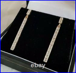 9ct Yellow gold drop earrings. Claw set with twenty two small diamonds