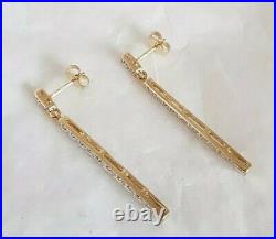 9ct Yellow gold drop earrings. Claw set with twenty two small diamonds