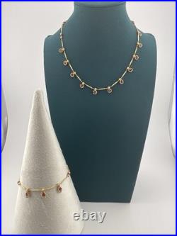 A Delicate 18k Sold Gold Italian Set Featuring Beaded Links And Drop Ruby