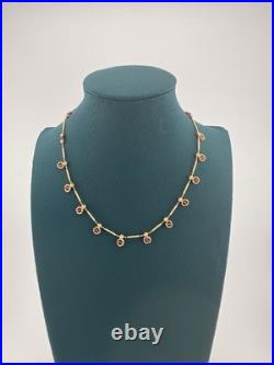 A Delicate 18k Sold Gold Italian Set Featuring Beaded Links And Drop Ruby