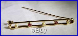 A Victorian 18ct Yellow Gold bar brooch/ tie pin. Set with seed pearls & Rubies