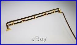 A Victorian 18ct Yellow Gold bar brooch/ tie pin. Set with seed pearls & Rubies