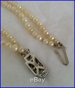 A Vintage twin Strand Pearl necklace. 9ct gold clasp, set with Rose cut diamonds