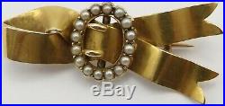 Antique 15 carat yellow gold pearl set ribbon and buckle brooch. Weighs 7.4 gms