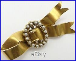 Antique 15 carat yellow gold pearl set ribbon and buckle brooch. Weighs 7.4 gms