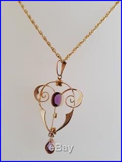 Art Nouveau 9ct gold pendant. Set with two Amethyst Gemstones & seed pearls. C1905