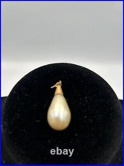 Baroque Pearl Secured By A Hammered 10k Gold Setting