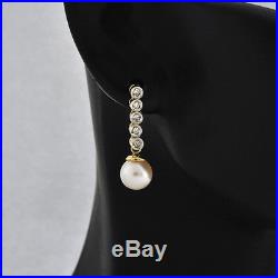 Beautiful 14k sold Gold Set 10pts Diamond & 7mm Cultural Pearl Dangle Earrings