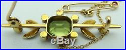 Boxed, antique 15 carat, yellow gold, Edwardian, pearl and peridot set brooch