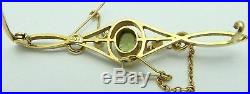Boxed, antique 15 carat, yellow gold, Edwardian, pearl and peridot set brooch