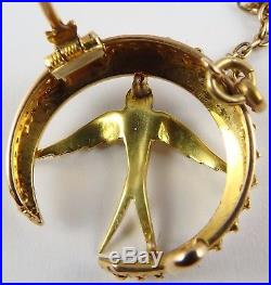 Boxed antique 15ct Gold seed pearl set crescent swallow brooch