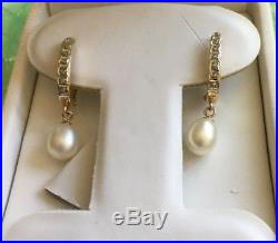 Diamond and Pearl Earrings set in 14k Gold marked SLC Hannoush Jewelers
