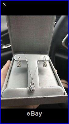 Diamond halo pendant and drop halo diamond earring set in white gold from zales