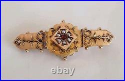 Etruscan 9ct Yellow gold bar brooch. Set with Ruby & seed pearls. Birmingham 1900