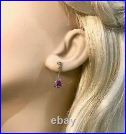 New 9ct Gold Halo Style Drop Earrings set with Rubies & Diamonds. 2.69gra