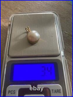 Pearl set in 18ct gold pendant 3.4g