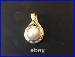 Pendant WithPearl Set In 14k Gold With Four Mini Diamonds Measured 1 7/8 X 3/4