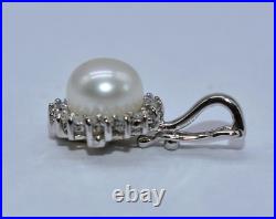 White Pearl & 0.40 CT TW White Diamond 14 K White Gold Pendant & Earrings Set White Pearl & 0.40 CT TW White Diamond 14 K White Gold Pendant & Earrings Set